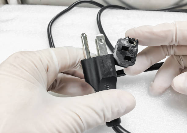 istock The socket is damaged burns and converter isolated on white background. Improper use of AC Power Plugs and Sockets cause of short circuit and fires at home 1270076450