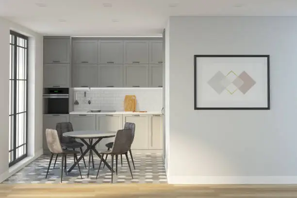 Photo of Interior of a gray kitchen with a round table in the middle, with glass doors to the balcony, with a horizontal poster on the wall. Mockup poster. Front view.