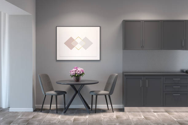 istock Kitchen interior with the horizontal poster above a round table with two chairs between gray kitchen cabinets and a doorway. Front view. 1270076628