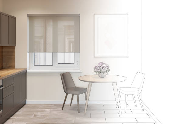 istock The sketch becomes a real kitchen interior with a window between a round table with two chairs and kitchen cabinets. There is a vertical poster on the wall above the table. Front view. 1270076650
