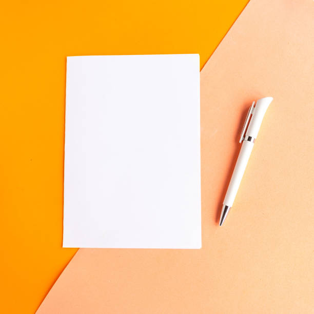 istock white mockup blank on geometric orange background. Copy space for the text. Vertical 1270077331