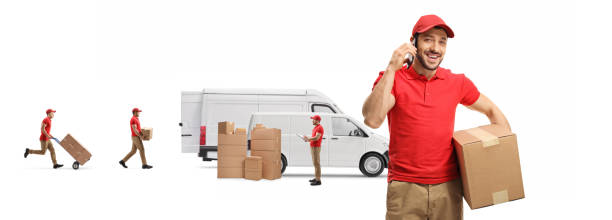 istock Delivery man talking on a mobile phone and workers loading boxes in transport vans 1270078015