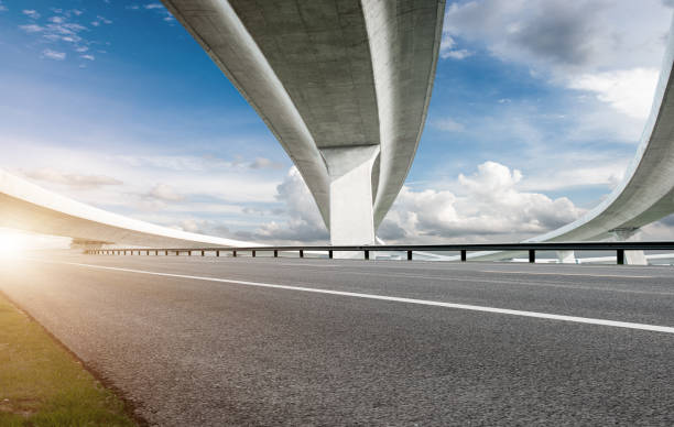 istock Clear sky, highway pavement under the overpass 1270078090