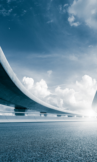 Clear sky, highway pavement under the overpass