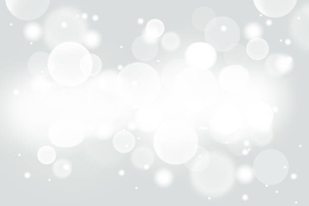 istock Gray abstract Christmas background with white bokeh stars blurred beautiful shiny light, use for card new year wallpaper backdrop 1270080426