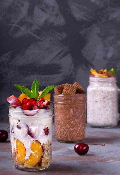 overnight oats assortment - three different refrigerators imagens e fotografias de stock