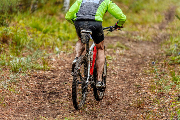 istock dirty man cyclist riding mountain bike 1270081936