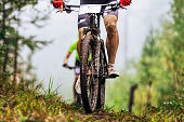 dirty feet cyclist athlete in mountain bike