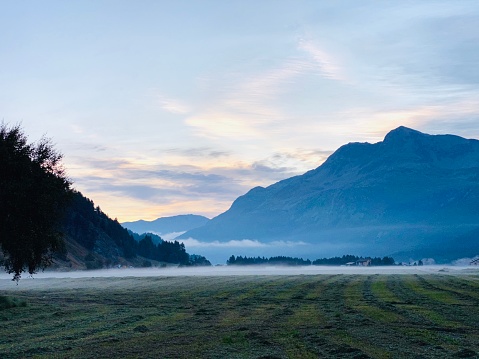 Upper Engadine landscape with morning fog