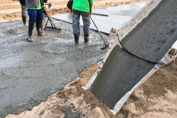 istock Workers pouring reinforced concrete floors on site 1270082411
