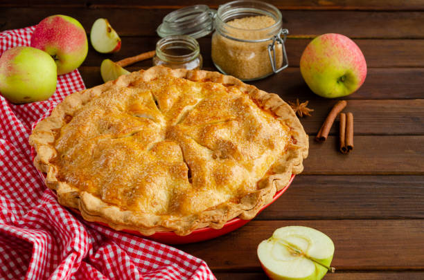 istock Classic American apple pie with cinnamon on a dark wooden background. Rustic style. Copy space. 1270084066