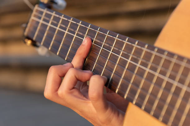 istock close-up woman hands playing the guitar 1270087813