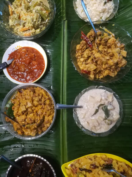 istock Onam special meals made with vegetables in separate vessels in an array. 1270088061