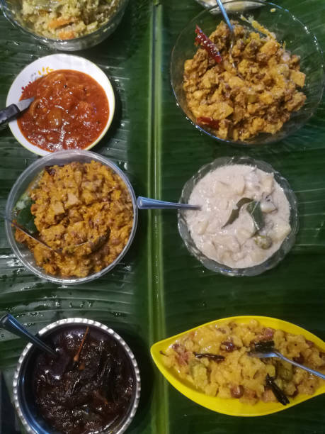 Onam special meals made with vegetables in separate vessels in an array.