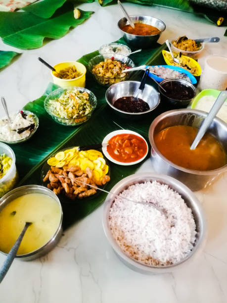 Onam special meals made with vegetables in separate vessels in an array.