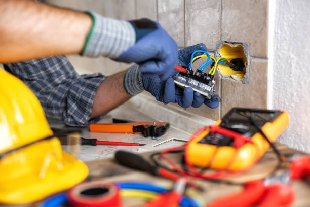 istock Electrician at work with safety equipment on a residential electrical system. Electricity. 1270091236