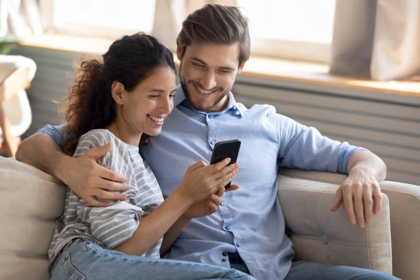 istock Addicted to modern technology family couple using smartphone. 1270093715