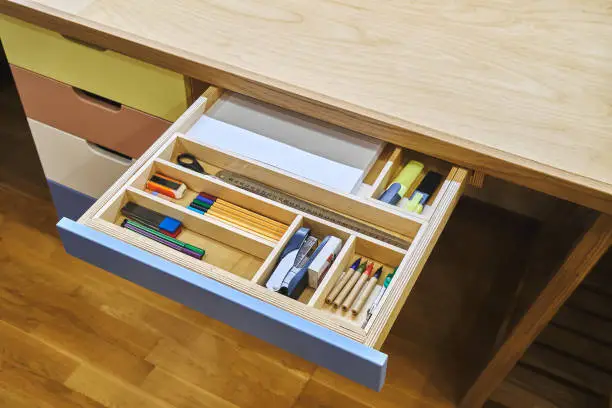 Photo of Ready for school. Neat drawer with assorted stationery for school