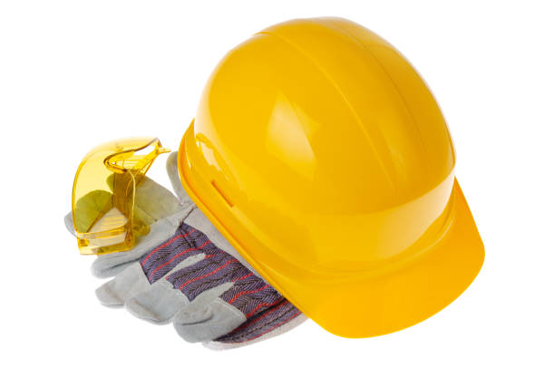 istock Yellow plastic hard hat glasses and protective gloves isolated on white background. Safe labor concept 1270094731