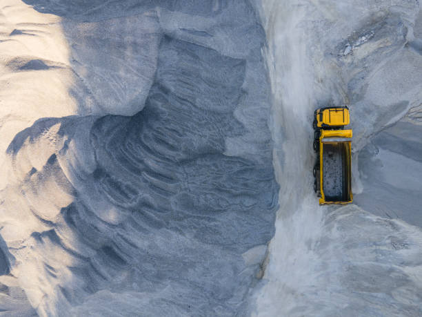 Building new highways in the mountain. Aerial view directly above over a highway construction site in the mountains, top view, cityscape. Global business, construction, transport and industry. Drone's flight over a construction landscape. Building new highways. Transportation event. quarry stock pictures, royalty-free photos & images