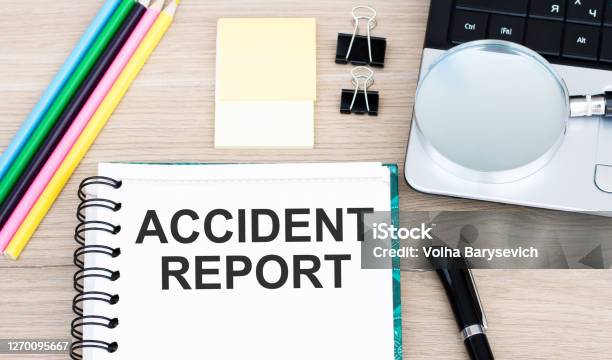 Accident Report Text On A Notebook Lying On The Table Stock Photo - Download Image Now