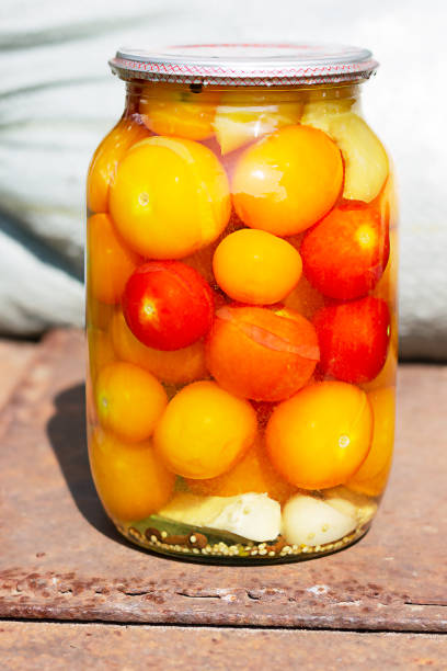 istock Tomatoes in a glass jar, homemade pickles 1270095763