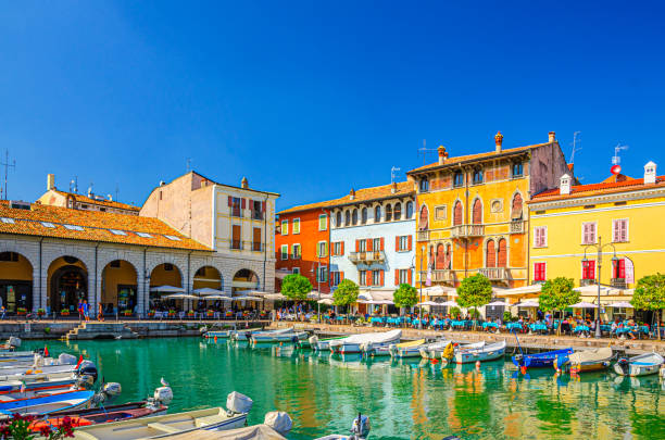 Old harbour Porto Vecchio with boats in Desenzano del Garda stock photo