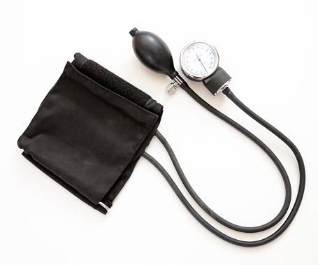 Hypertension control, Blood pressure measure, Medical sphygmomanometer isolated on white color background, top view. Health cardio checkup concept.