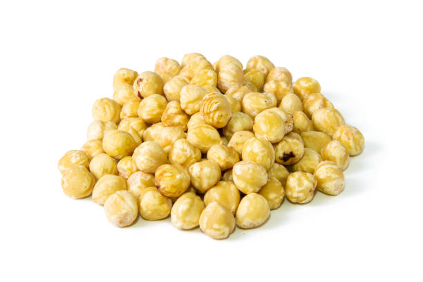 istock Peeled hazelnuts isolated on white background. Front views, close-up 1270098767