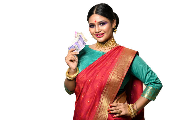 istock Young woman holding Indian rupee notes 1270099457