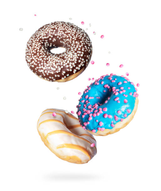 istock Various donuts with motley glaze in the air on a white background 1270104645