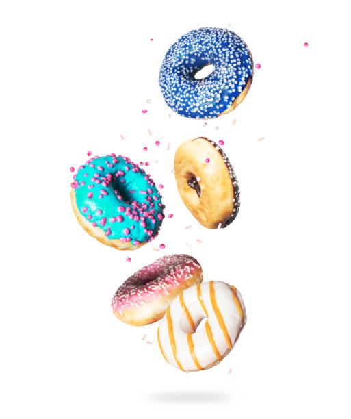 istock Various donuts with motley glaze in the air on a white background 1270104655