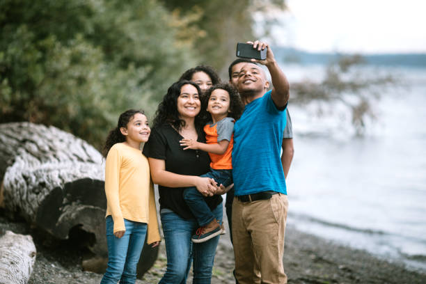 istock Family Taking Selfie Together on Pacific Northwest Beach 1270104851
