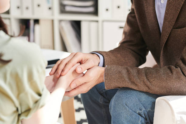 istock Psychologist Comforting Young Woman 1270105846