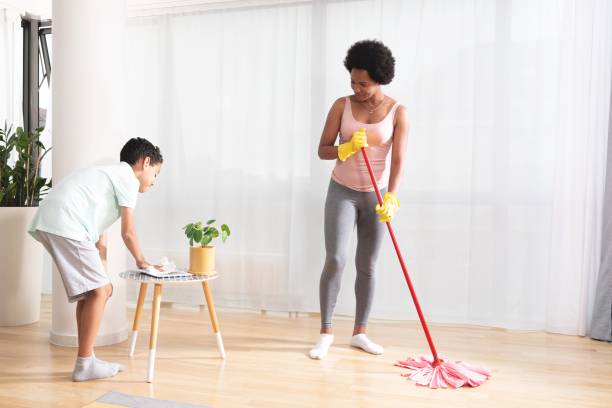 Mother and son cleaning the house Mother and son cleaning the house mop photos stock pictures, royalty-free photos & images