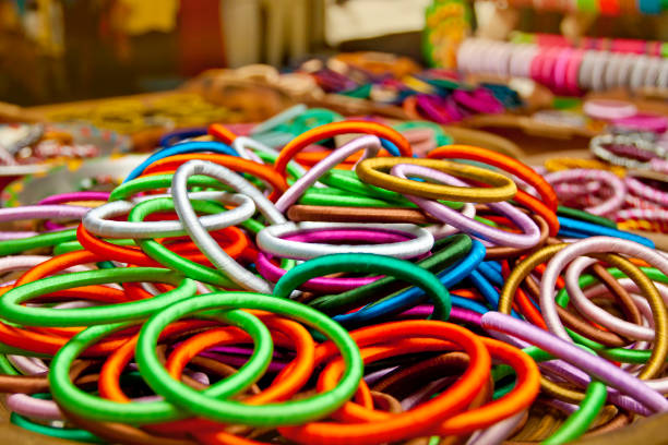 istock Variety colored handmade bangles are displayed with on some small baskets for sale. 1270107405