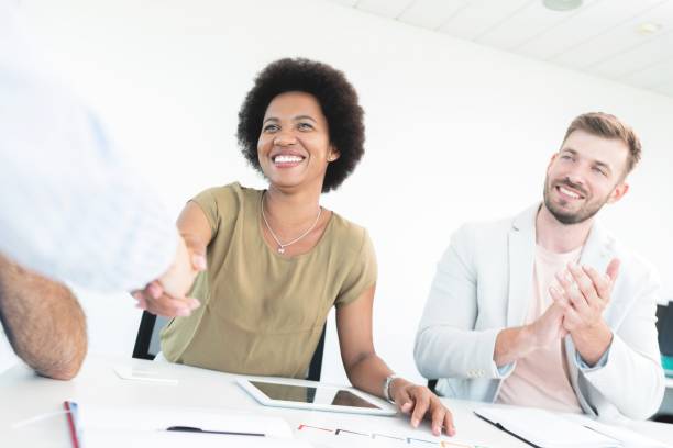 istock Business people shaking hands at office 1270107414