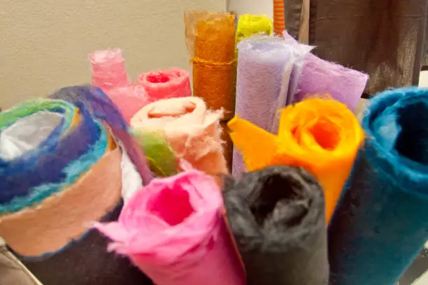 A variety of colored handmade colored-paper is on display.
