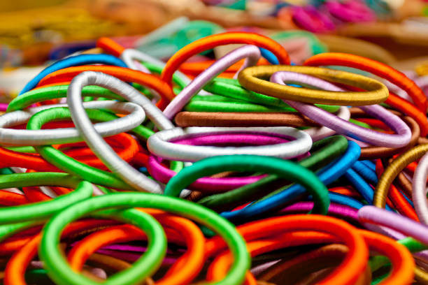 istock Variety colored handmade bangles are displayed with on some small baskets for sale. 1270108716