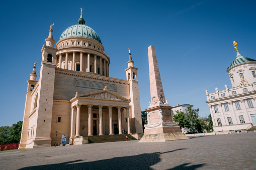 Italy, Milan - August 30, 2022: Famous buildings of Italy. Action. Beautiful monuments on architectural palace of Italy. Cultural attractions and sculptures on buildings of ancient historical city. Monuments and Vittoriano Palace in Rome.