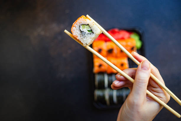 istock sushi rolls fish salmon, vegetables, ginger wasabi rice and nori on the table serving portion size top view place copy space for text 1270109724