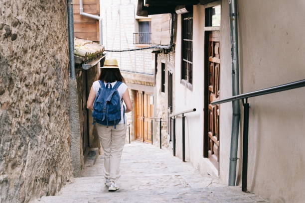 istock Woman sightseeing walking down a street 1270111918