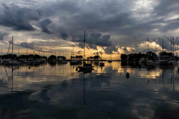 istock sailboats reflected in calm water in a harbor 1270112189