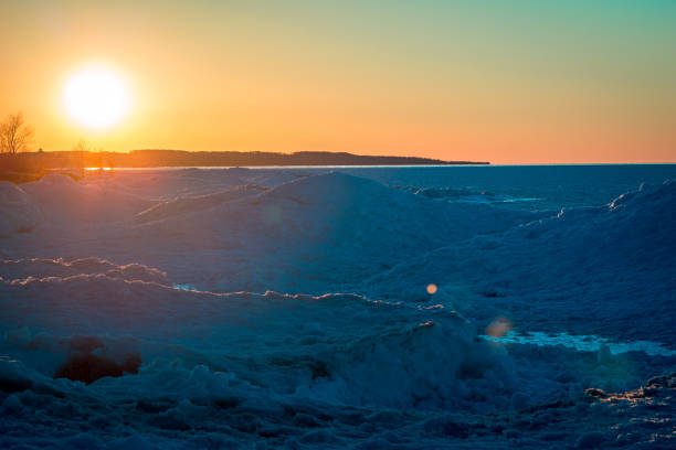 istock Lake Michigan frozen over creating ice dunes at sunset 1270113502