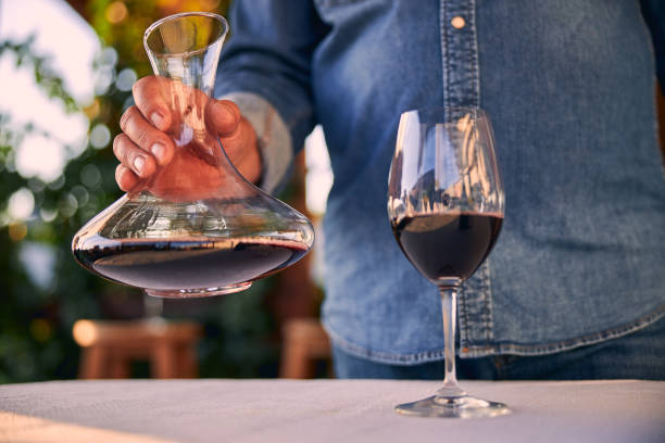 istock Old red wine in the glass and in decanter 1270114600