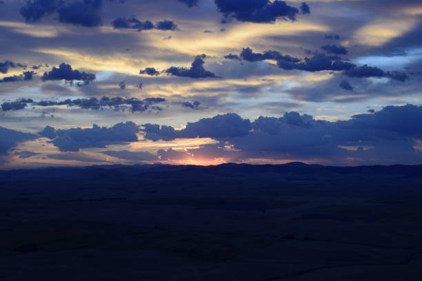 istock High Angle View Of Silhouetted Landscape Against Dramatic Cloudy Sky Just Before Sunrise 1270115646
