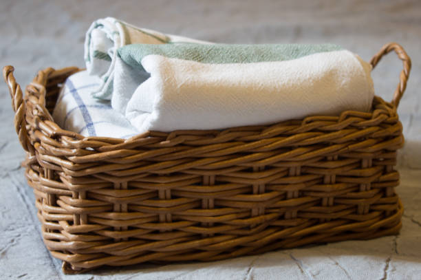 istock Brown wicker basket with towels 1270118809