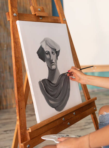 Fine art students painting portrait