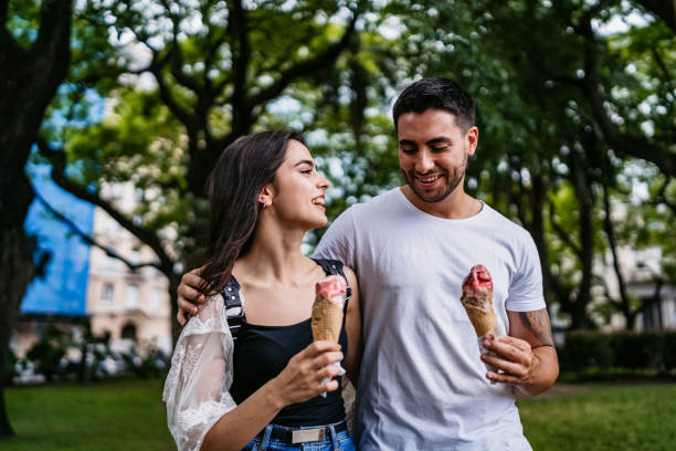 istock Happy couple eating ice cream 1270119412