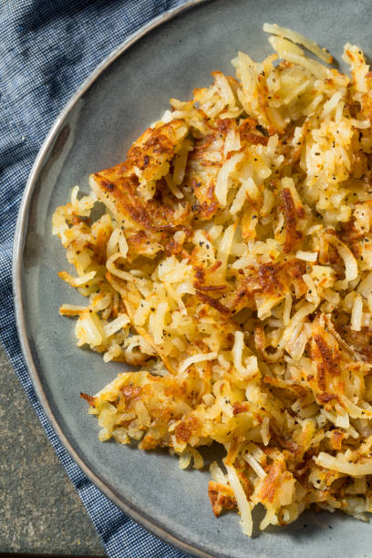 istock Homemade Fried Shredded Hashbrowns and Eggs 1270120996
